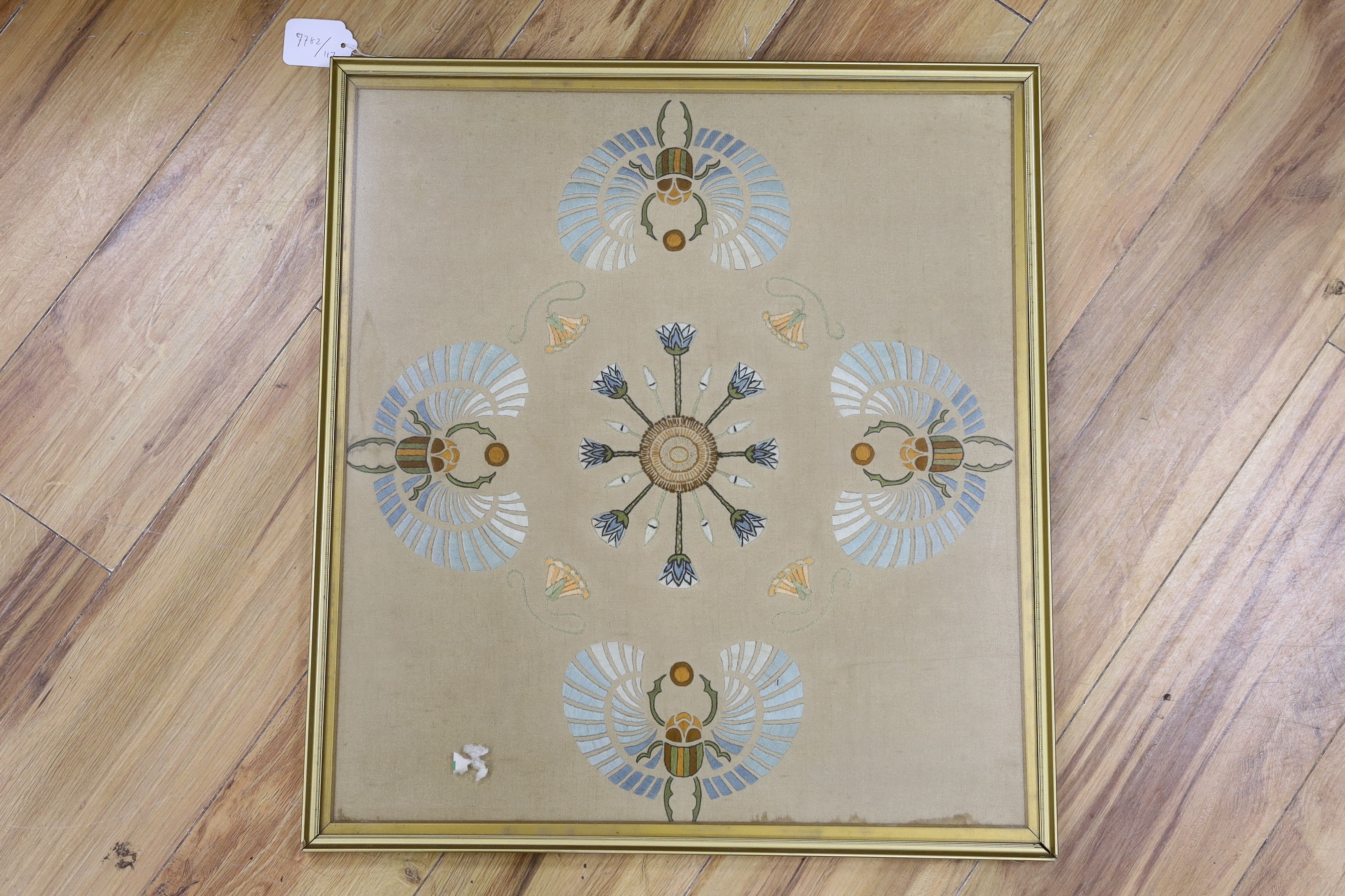 An Arts and Crafts multi coloured silk embroidery of stylistic scarab beetles. 58 x 50cm